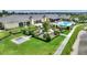Aerial image of clubhouse with giant chess game and water view at 4175 Muirfield Loop, Lake Wales, FL 33859