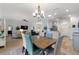 Open-concept living and dining area filled with natural light, showcasing the home's layout at 4175 Muirfield Loop, Lake Wales, FL 33859