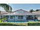 Screened in pool in backyard, perfect for relaxing and entertaining, with partial view of home at 4175 Muirfield Loop, Lake Wales, FL 33859