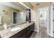 Bathroom featuring a large vanity with a marble countertop and plenty of storage at 418 North Rd, Lakeland, FL 33809
