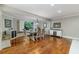 Cozy dining room with hardwood floors, a large window, and stylish decor at 418 North Rd, Lakeland, FL 33809