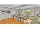 Bright dining room with backyard view, hardwood floors, and stylish furniture at 418 North Rd, Lakeland, FL 33809