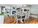 Charming dining area with hardwood flooring, fireplace, and an open layout at 418 North Rd, Lakeland, FL 33809