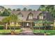 Charming brick home featuring a manicured lawn, complemented by lush palm trees and a welcoming brick pathway at 418 North Rd, Lakeland, FL 33809