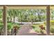 Inviting front porch overlooking a beautifully landscaped front yard with a charming brick pathway at 418 North Rd, Lakeland, FL 33809