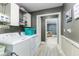 Functional laundry room with washer, dryer, overhead shelving, and neutral paint at 418 North Rd, Lakeland, FL 33809