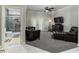 Cozy living room with a large TV, comfortable seating and an ensuite bathroom at 418 North Rd, Lakeland, FL 33809
