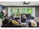 Comfortable living room boasts backyard views, plush seating and modern decor at 418 North Rd, Lakeland, FL 33809