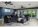 Inviting living room with sliding glass doors, neutral decor, and comfortable seating at 418 North Rd, Lakeland, FL 33809