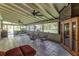 Enclosed patio offering a dining area, backyard views, and lots of natural light with ceiling fans at 418 North Rd, Lakeland, FL 33809