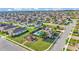 Panoramic aerial shot featuring the community pool, playground, and neighborhood landscape at 428 Aragosa Dr, Davenport, FL 33837