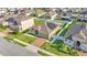 Aerial shot of the home featuring a well-maintained lawn, a white fence, and a charming facade at 428 Aragosa Dr, Davenport, FL 33837