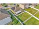 Aerial view of the home showcasing the large backyard, white fence, and solar panels at 428 Aragosa Dr, Davenport, FL 33837