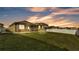 Large, green backyard featuring a screened-in patio for outdoor living and entertaining at 428 Aragosa Dr, Davenport, FL 33837