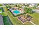 Aerial view showcasing the community pool, playground, and surrounding green space for residents at 428 Aragosa Dr, Davenport, FL 33837