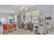 Bright dining room with equipment, natural light, and modern chandelier at 428 Aragosa Dr, Davenport, FL 33837