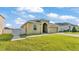 Charming home with well-kept lawn and a brick driveway featuring easy gate access at 428 Aragosa Dr, Davenport, FL 33837