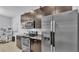 A stainless steel refrigerator compliments stainless oven, microwave and granite countertops at 428 Aragosa Dr, Davenport, FL 33837