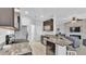 Modern kitchen with granite countertops, stainless steel appliances, and dark wood cabinets at 428 Aragosa Dr, Davenport, FL 33837