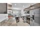 Kitchen featuring stainless steel appliances, granite countertops, and ample cabinet space at 428 Aragosa Dr, Davenport, FL 33837