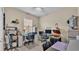 Brightly lit office space with tiled floors, two desks, and ample storage at 428 Aragosa Dr, Davenport, FL 33837