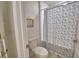 Bathroom featuring a toilet and a shower with a decorative curtain at 4400 Trotters Way, Lakeland, FL 33801