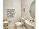 Cozy powder room with pedestal sink, and coastal-themed decor at 4400 Trotters Way, Lakeland, FL 33801