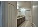 Bathroom with double sinks, granite countertops and tile floors at 4400 Trotters Way, Lakeland, FL 33801