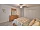 Comfortable bedroom with a spacious closet, wooden dresser, and a ceiling fan at 4400 Trotters Way, Lakeland, FL 33801
