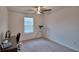 Bright bedroom featuring a large window for natural light and a telescope at 4400 Trotters Way, Lakeland, FL 33801
