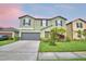 Charming two-story home with a well-maintained lawn, garden and two-car garage at 4400 Trotters Way, Lakeland, FL 33801