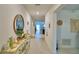 Inviting hallway with tiled flooring, neutral walls, and decorative accents at 4400 Trotters Way, Lakeland, FL 33801
