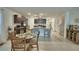 Modern kitchen with granite countertops and stainless steel appliances open to the living and dining areas at 4400 Trotters Way, Lakeland, FL 33801
