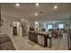 Open concept kitchen with granite countertops, stainless steel appliances, and view to the living room at 4400 Trotters Way, Lakeland, FL 33801