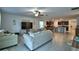 Open-concept living room with view to the kitchen, providing ample space for gatherings at 4400 Trotters Way, Lakeland, FL 33801