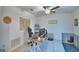 Home office with desk, ceiling fan, tile floors and bright natural light at 4400 Trotters Way, Lakeland, FL 33801