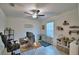 Home office with desk, ceiling fan, tile floors and bright natural light at 4400 Trotters Way, Lakeland, FL 33801