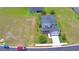 Aerial view of beautiful 2-story home with a 2-car garage and well-manicured landscaping at 445 Waterfern Trail Dr, Auburndale, FL 33823
