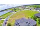 Panoramic aerial view of houses, lakes and community amenities providing a beautiful picturesque view at 445 Waterfern Trail Dr, Auburndale, FL 33823