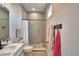 Bathroom featuring tiled shower, hexagon tile flooring and a white vanity with sink at 445 Waterfern Trail Dr, Auburndale, FL 33823