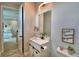 Bathroom featuring white vanity with sink, toilet, and neutral paint with stylish decor at 445 Waterfern Trail Dr, Auburndale, FL 33823