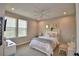 Bright bedroom boasts natural light, a ceiling fan, and a charming vanity area at 445 Waterfern Trail Dr, Auburndale, FL 33823