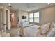 Bright bedroom boasts natural light and an ensuite bathroom at 445 Waterfern Trail Dr, Auburndale, FL 33823