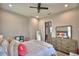 Bright bedroom with light gray walls, light wood-look flooring, and view of the hallway and adjacent rooms at 445 Waterfern Trail Dr, Auburndale, FL 33823