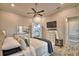 Bedroom featuring a ceiling fan, wood look floors, and stylish decor at 445 Waterfern Trail Dr, Auburndale, FL 33823