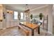 Charming dining space showcasing a wooden table, bench seating, and custom built-in storage at 445 Waterfern Trail Dr, Auburndale, FL 33823