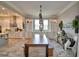 Elegant dining area featuring a large wooden table, custom built-ins, and stylish decor at 445 Waterfern Trail Dr, Auburndale, FL 33823