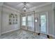 Dining room featuring hardwood floors, natural light and decoratively framed photos at 445 Waterfern Trail Dr, Auburndale, FL 33823