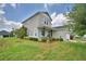 Beautifully landscaped front yard with a covered porch and well-maintained lawn, creating curb appeal at 445 Waterfern Trail Dr, Auburndale, FL 33823