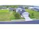Attractive two-story home exhibiting a clean facade, neat landscaping, and a spacious two-car garage at 445 Waterfern Trail Dr, Auburndale, FL 33823